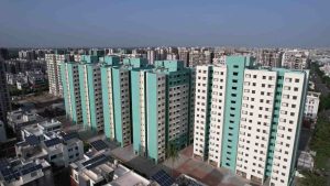 Finance Minister Kanubhai Desai inaugurating 1060 EWS flats and computerized draw of 1498 flats under 'PM Awas Yojana