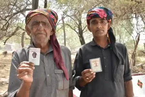 Polling station set up in shipping container for voters of Aliabet surrounded by water