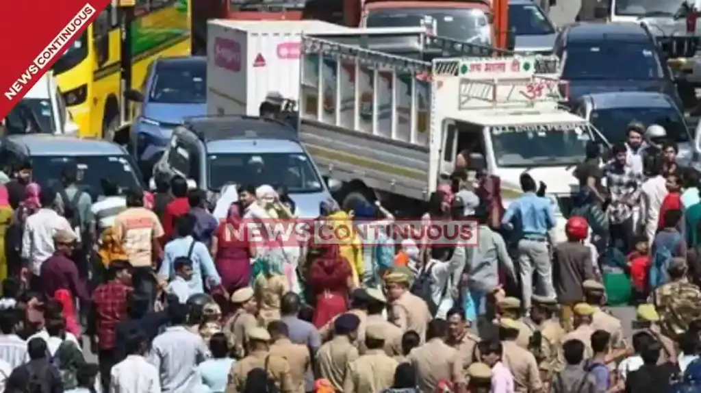 Noida Salary Protest Turns Violent Workers clash with police set vehicles on fire tear gas shells fired to control mob.